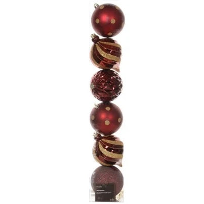 A set of six bordeaux red and gold Christmas bauble ornaments with a shiny, matt, and glitter finish, stacked on a round base.