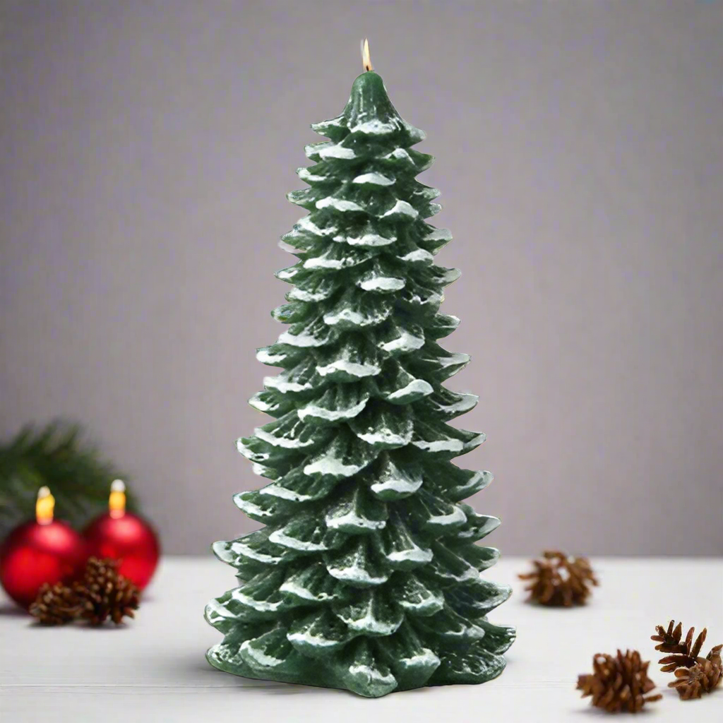 Christmas tree-shaped candle with red ornaments and pine cones on a gray background
