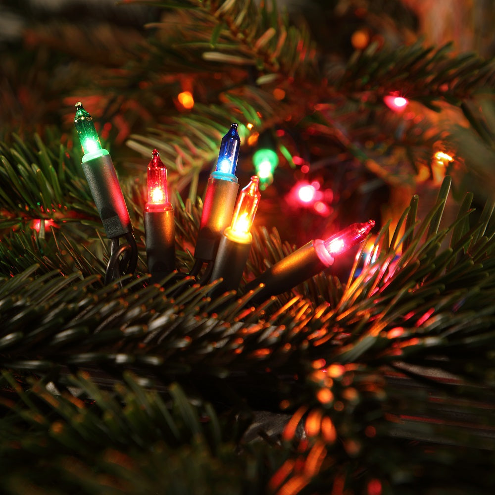 Multicolored fairy Christmas lights on a Christmas tree