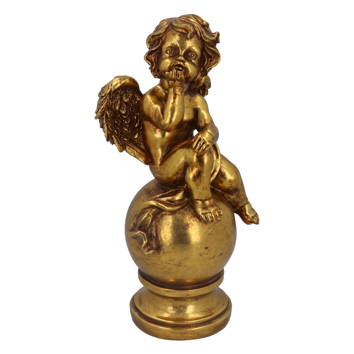 A gold-colored cherubic figure sitting on a ball, which is a Christmas ornament.