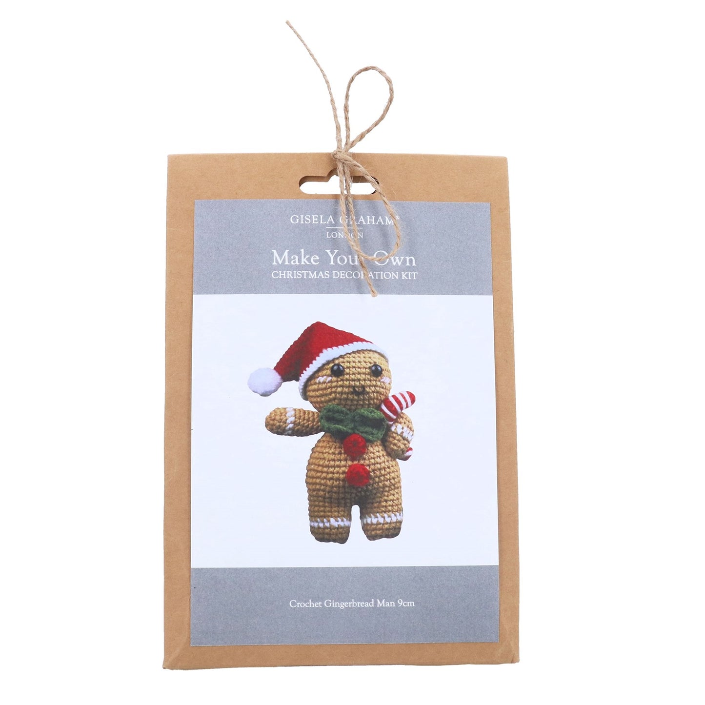 Gingerbread man decoration kit packaging with a gingerbread man wearing a Santa hat and scarf on a white background.
