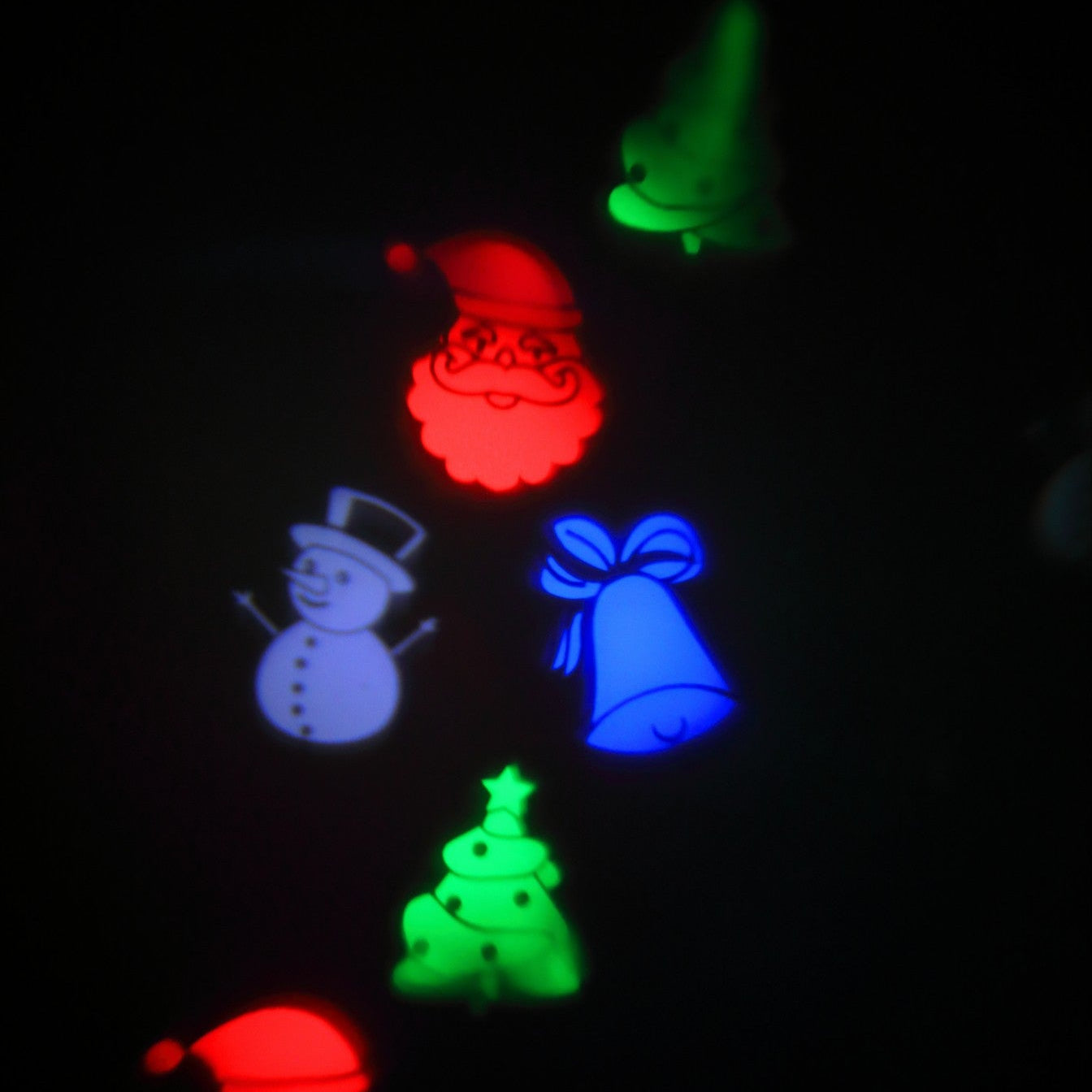 Glowing Christmas-themed shapes on a dark background