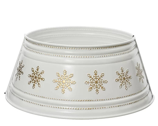 A white Christmas tree skirt with gold snowflakes embossed on it, with a collapsible metal frame.