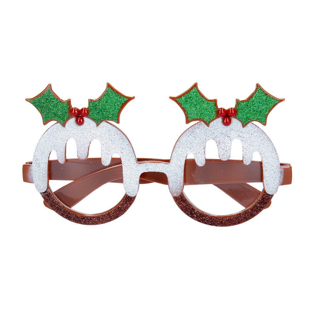 A pair of novelty Christmas pudding glasses with a glitter finish and acrylic construction, featuring red and green Christmas pudding designs on a brown base.