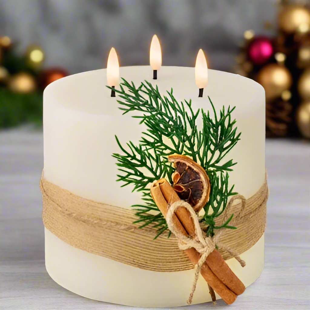 A cream-colored LED 3-wick wax Christmas candle with a leaf decoration and a jute string bow, displayed against a festive background with Christmas lights and decorations.