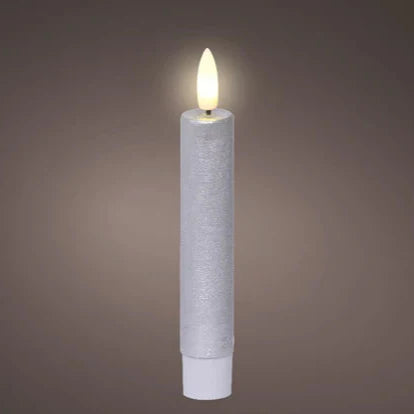 A single silver LED wick flat top wax dinner candle with a warm white light, designed to fit in candelabras or candle stick holders.
