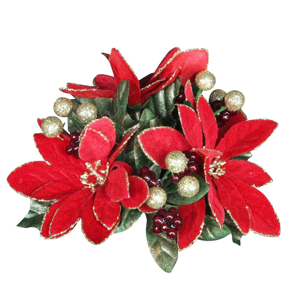 Decorative arrangement with red flowers, green leaves, and gold berries on a white background