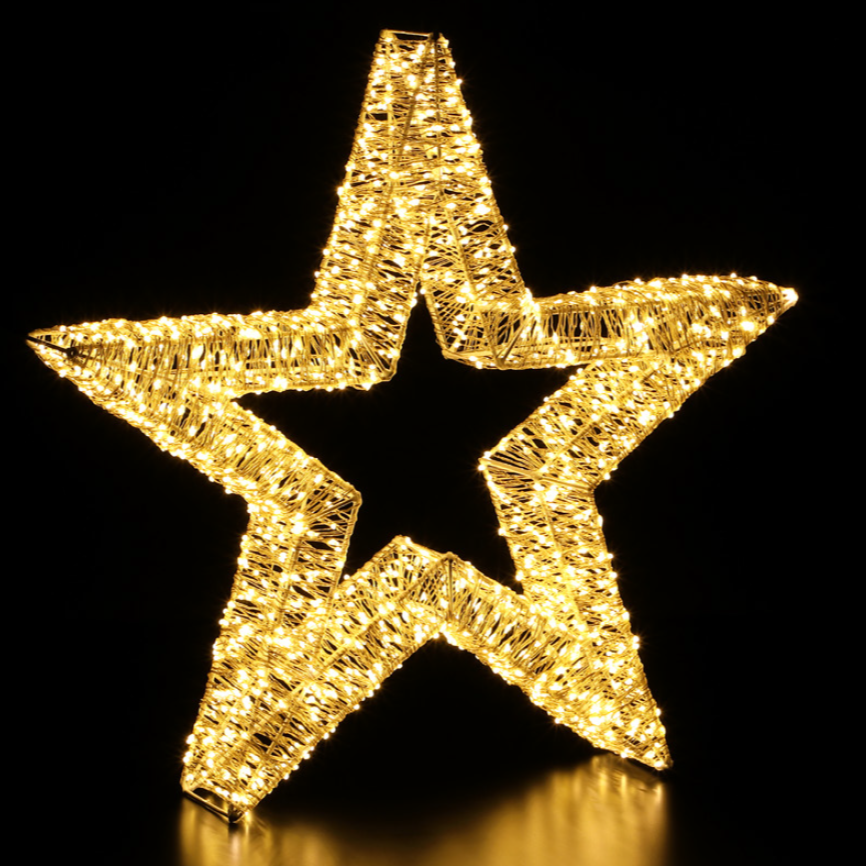 A double-sided 3D wire star-shaped LED light display with a warm white glow, capable of being used for indoor or outdoor decoration.