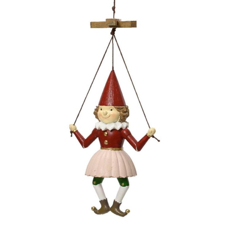 hanging puppet elf doll dressed in red hat and pink skirt