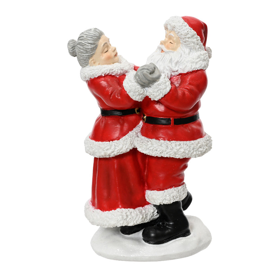 A hand-painted ceramic Christmas ornament featuring a Mr. and Mrs.