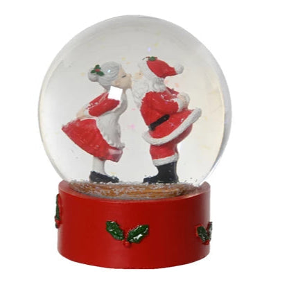 Christmas snowglobe with Santa and Mrs Claus kissing