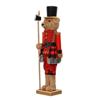 Bear figurine in a red outfit with a top hat and staff