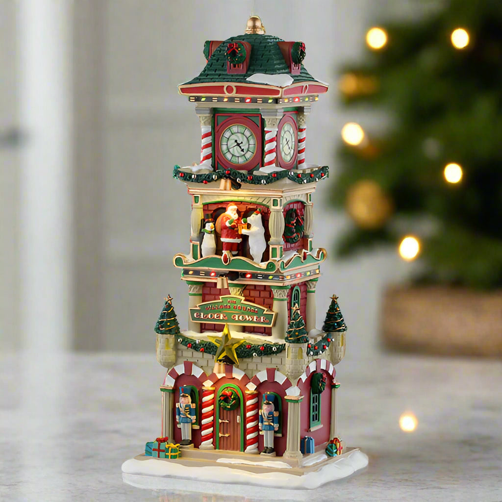 Decorative Christmas clock tower with Santa Claus and Nutcrackers on a white background