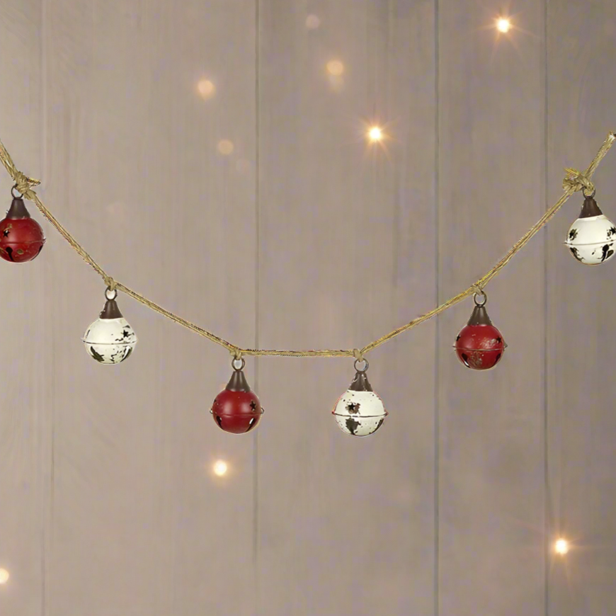 A Vintage Style Red and White Christmas Bell Garland with metal bells and jute rope.