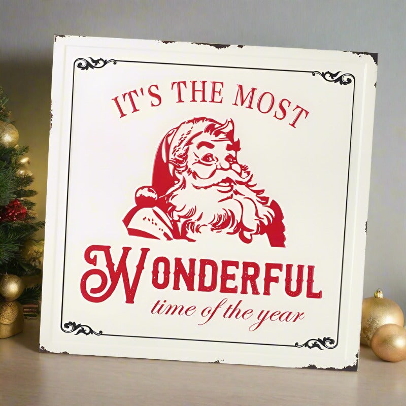 Vintage style metal sign with a red Santa face with the wording "it's the most wonderful time of the year.