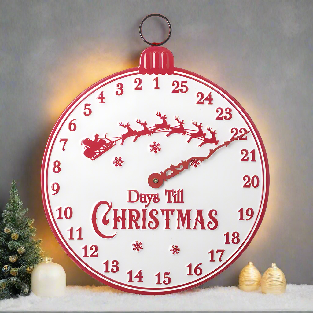 A round, red and white Christmas countdown sign with numbers from 1 to 24 and a graphic of a reindeer and snowflakes on it, with the text 'Days Till Christmas' on the outer part.