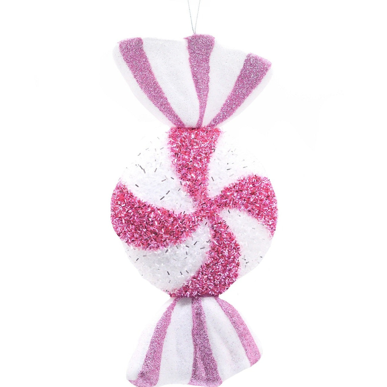 A hanging Christmas decoration shaped like a candy with pink and white stripes and glitter on it.