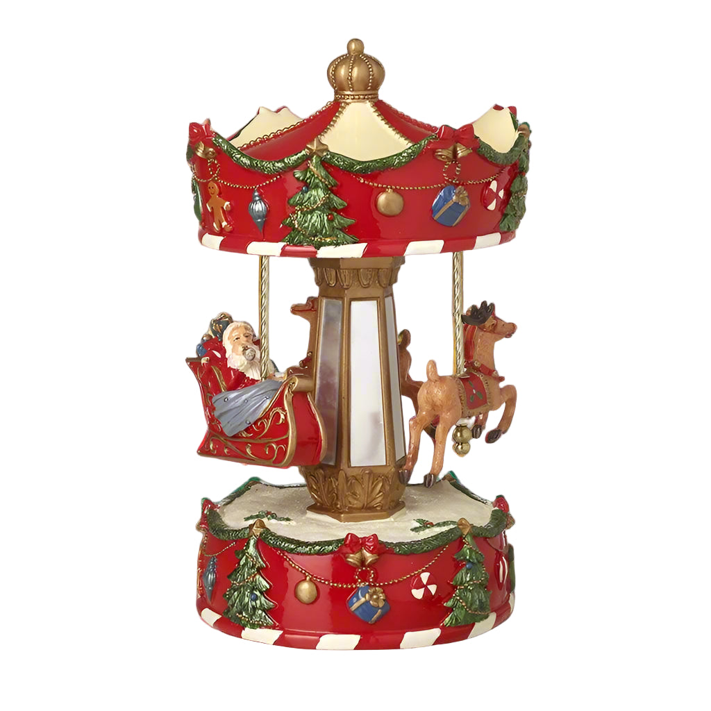 A decorative Santa Sleigh Spinning Christmas Merry Go Round with Santa and reindeer figures, decorated with red and green accents on a 25cm tall ornately decorated base.
