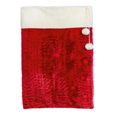 Red textured blanket with white trim and pom-poms on a white background