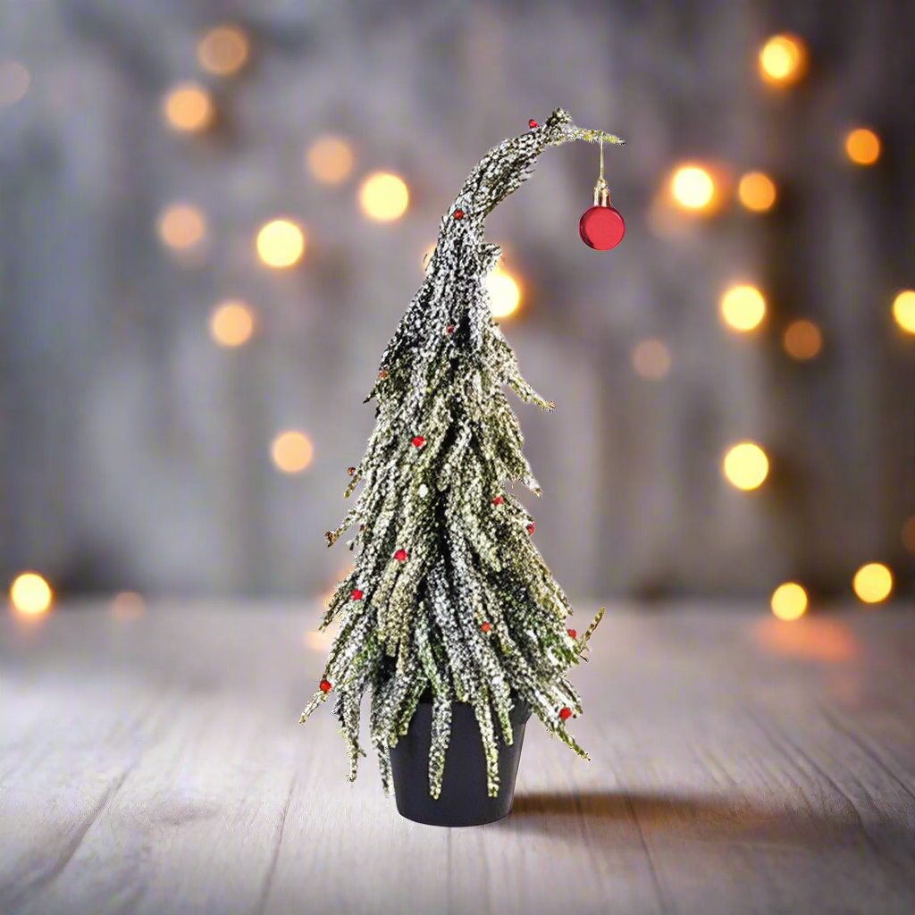 Decorative Christmas tree with lights and a red ornament on a white background