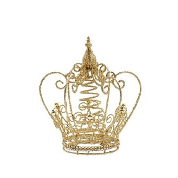 A gold glittery Christmas tree topper in the shape of a crown.