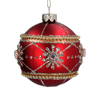 A matt red glass Christmas ornament with a geometric pattern of diamantes and beads.