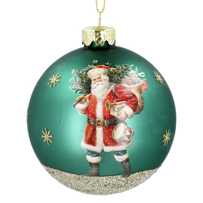 A round glass hanging ornament featuring a depiction of Santa Claus in a green Christmas tree.