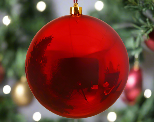 A large red shiny Christmas bauble with a reflective surface, 25cm in diameter.