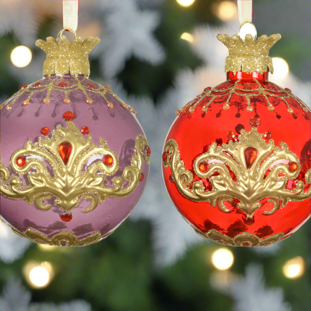 Two ornate Christmas ornaments, one purple and one red, with gold detailing on a white background.
