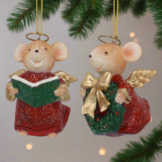 Two Christmas mouse ornaments, one singing and one with a gift, on a white background.