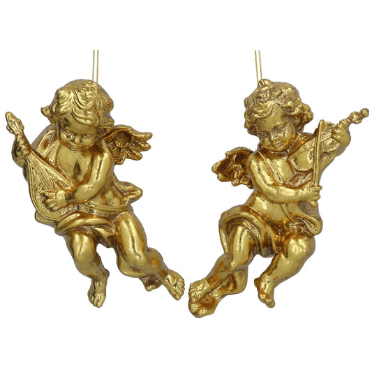 Two gold cherub figurines with lyres on a white background