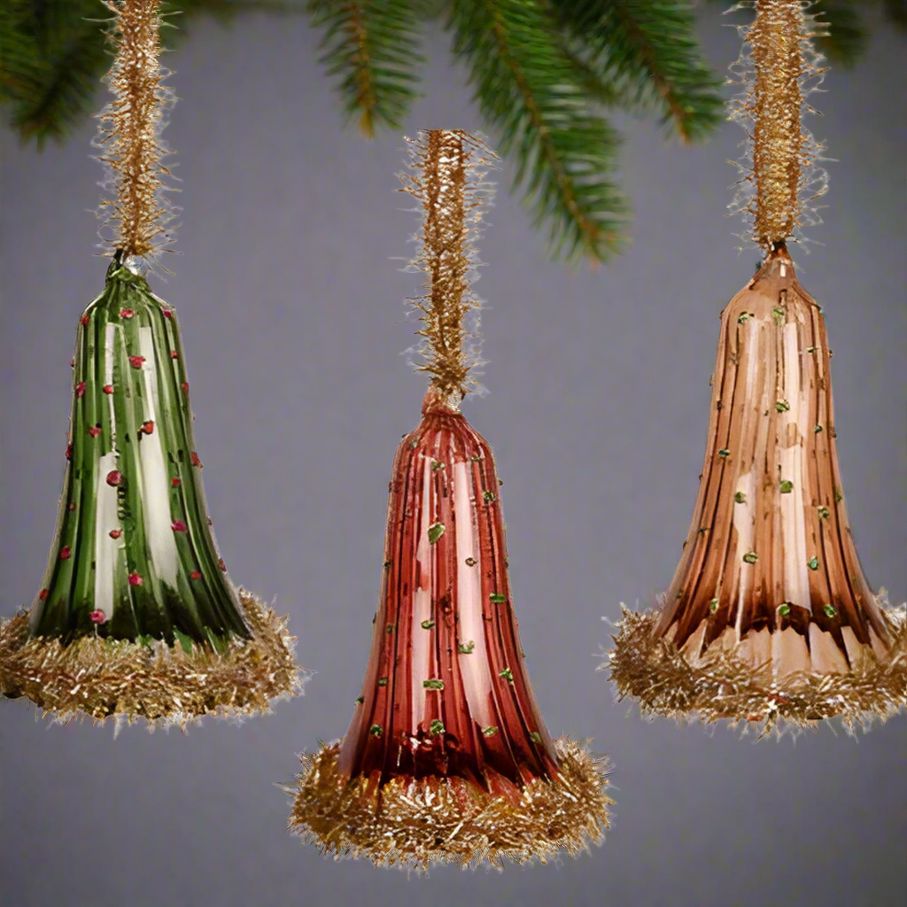 Three decorative cones with tinsel on a white background
