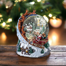 Load image into Gallery viewer, Christmas Snow Globe with Santa and Sleigh over the Village
