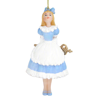 A resin figurine of Alice in Wonderland dressed in a blue and white outfit with a white apron, hanging as a Christmas tree decoration.