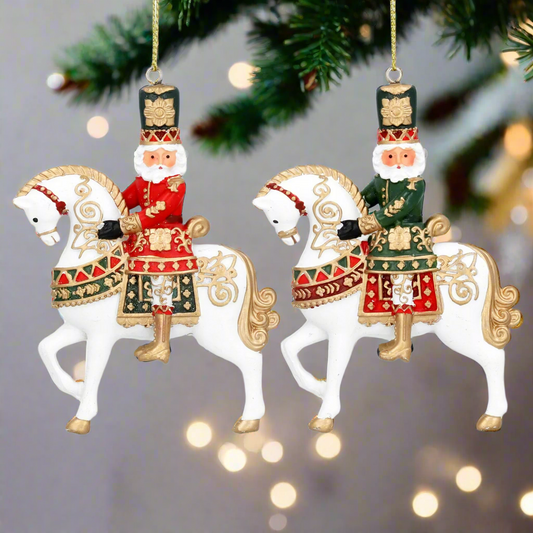 Two decorative Christmas ornaments featuring soldiers on horseback with intricate designs.