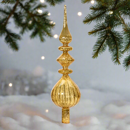An antique gold glass Christmas tree topper with a tarnished gold finish, featuring a conical shape with ornate detailing at the top.