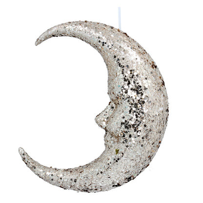 Decorative moon-shaped candle with a textured surface on a white background