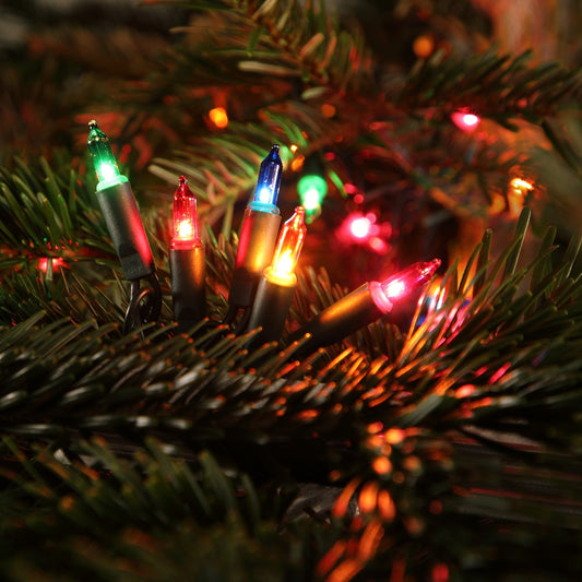 Multicolored fairy Christmas lights on a Christmas tree