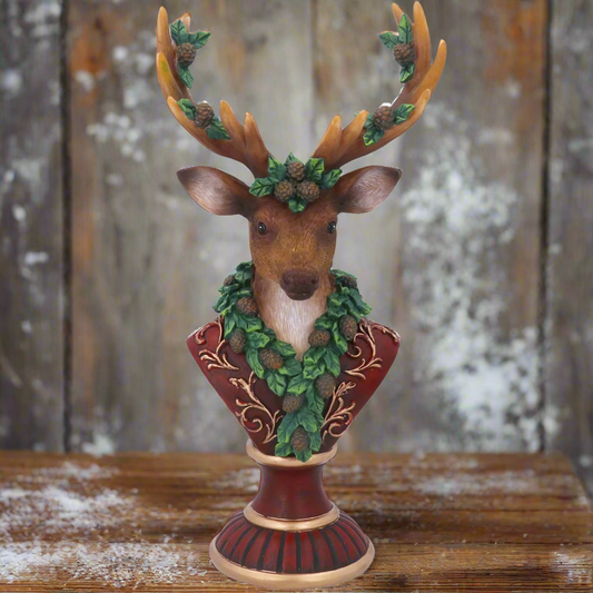 Decorative deer bust with antlers and foliage on a white background