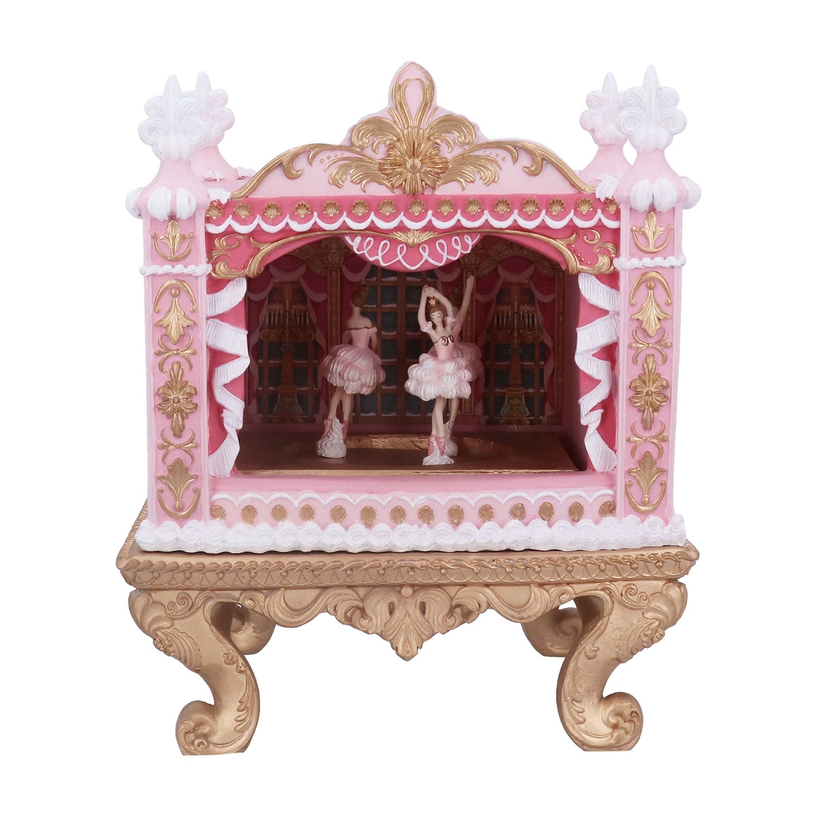 Decorative pink and gold cabinet with ballerina figurines on a white background