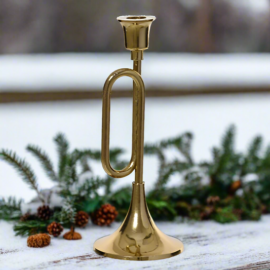 Brass candle holder on a white background