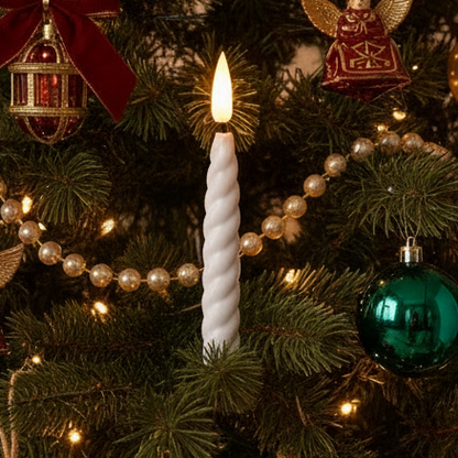A white twist candle with a remote control for Christmas tree lights. The candle is wrapped around a cylindrical form, presumably the candle holder, and the remote has three buttons labeled 'on', 'off', and 'time'.