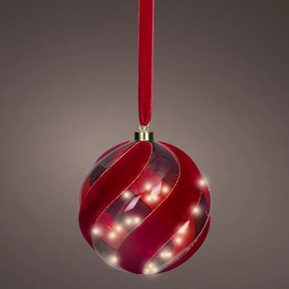 Decorative red ornament with LED lights on a gray background