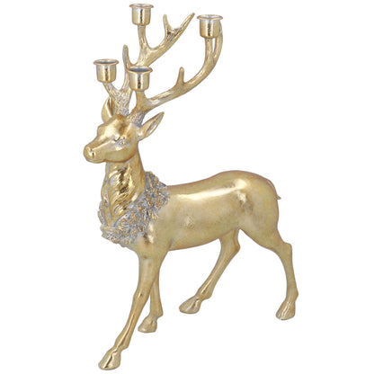 Gold deer-shaped candle holder with antlers on a white background