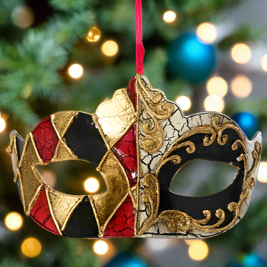 Decorative mask ornament on a Christmas tree with blurred lights in the background