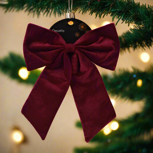Maroon velvet bow on a white background