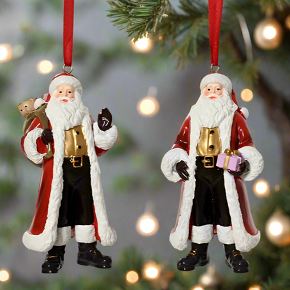Two Santa Claus ornaments hanging on a Christmas tree with lights in the background.