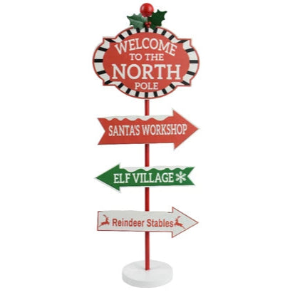 Christmas-themed directional sign with text and arrows on a white background