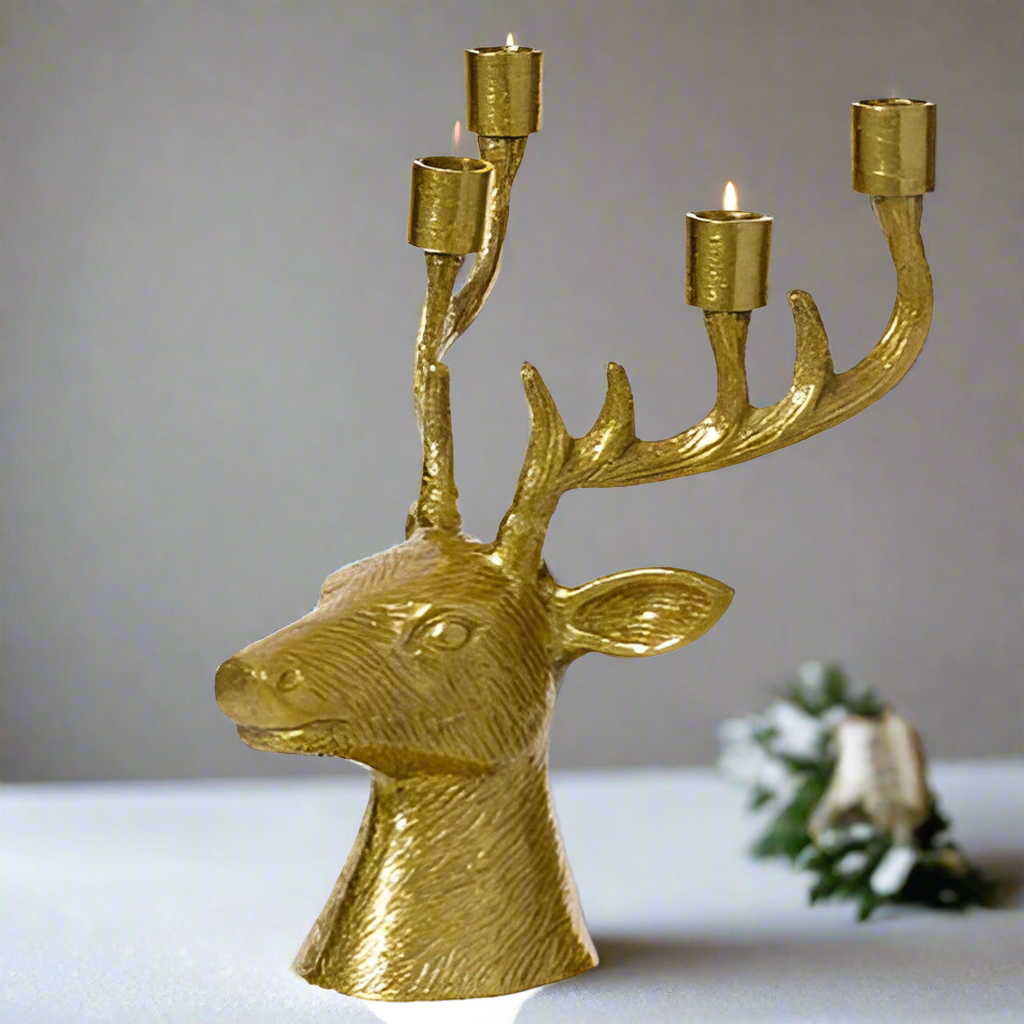 Gold deer head candle holder with four candle holders on a white background