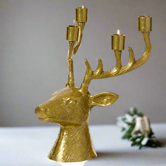 Gold deer head candle holder with four candle holders on a white background